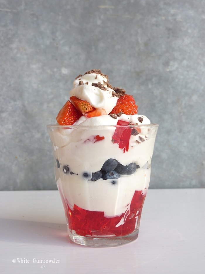 JellO with strawberries, blueberries, and whipped cream